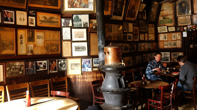 People eating inside McSorley's Old Ale House