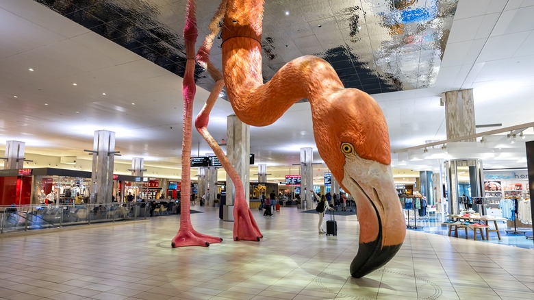 A giant flamingo sculpture by Matthew Mazzotta at Tampa International Airport