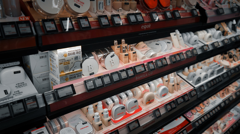 close up of k-beauty brands on shelves inside an Olive young store