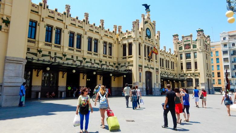 Travelers outside of the entrance of Estació del Nord, Valencia, Spain