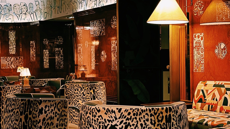 warm interior with leopard print seating and wall art