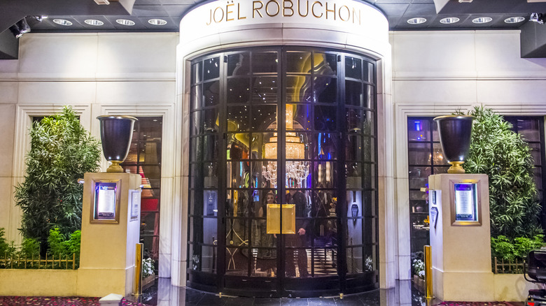 glass front door of the restaurant fron the outside