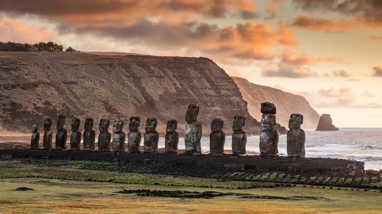a row of moai statues at sunset in Rapa Nui National Park