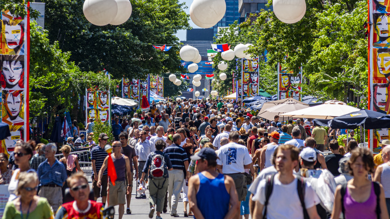 throngs of pedestrians in summer on Saint Catherine Street