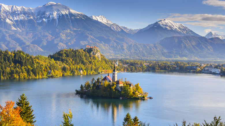 Panoramic view of Lake Bled and Bled Castle below the Julian Alps in Slovenia on a clear day