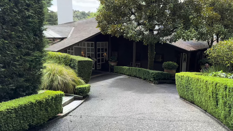 The entrance to Huka Lodge, tucked in the trees in New Zealand