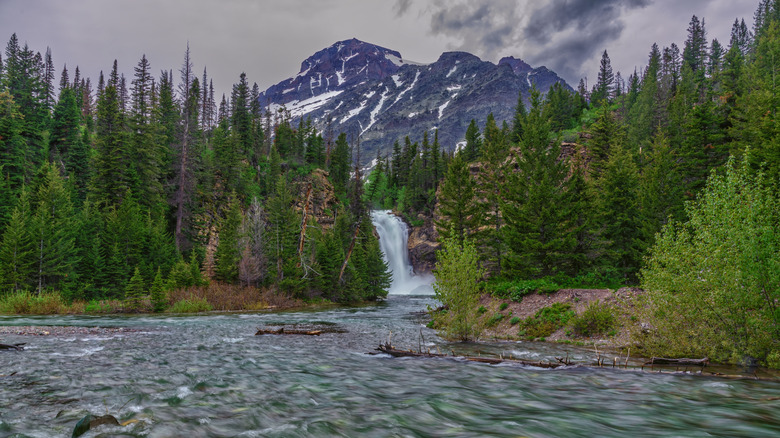 A waterfall and river in Glacier National Park in Montana, USA.