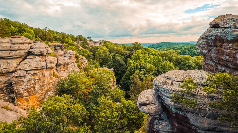 Rock formations jut out over the Shawnee National Forest during a summer day near Pomona, Illinois