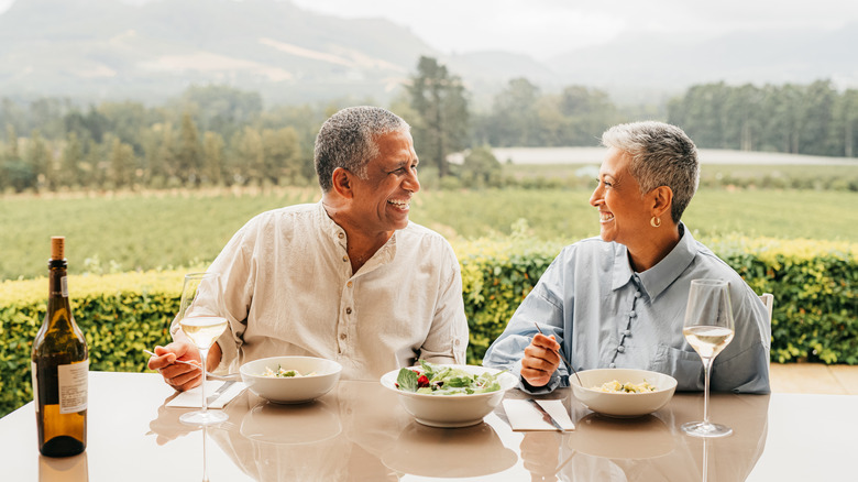 Senior couple eating in farm-to-table setting