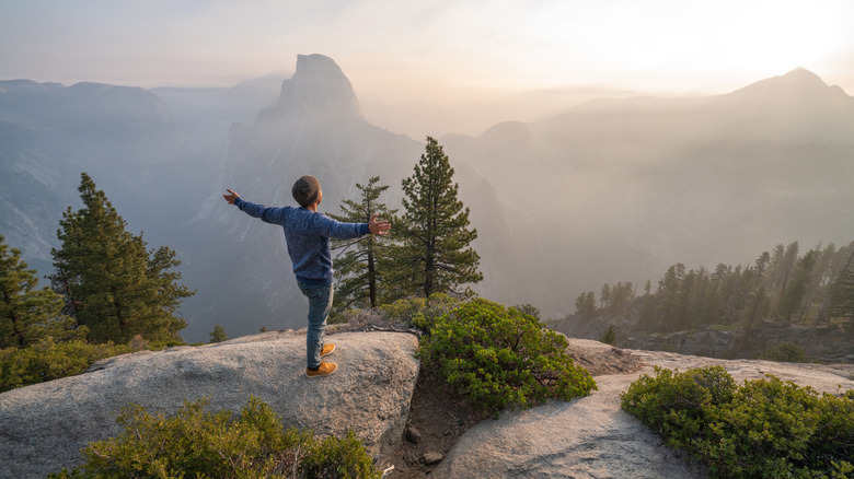 A man taking in a sunrise at Yosemite National Park in California