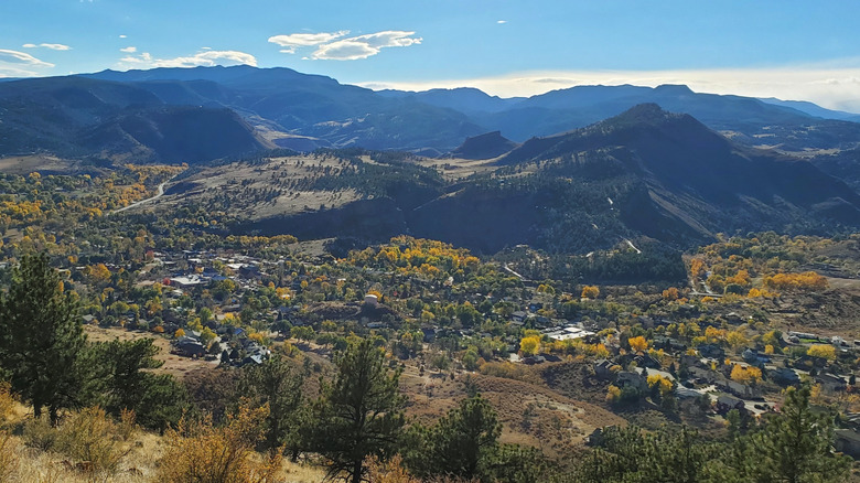 Aerial view of Lyons, Colorado, in a valley surrounded by mountains during autumn