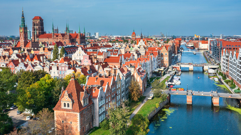 Aerial view of Gdansk, Poland, along the historic riverfront and to the well-preserved Old Town, on a sunny summer's day