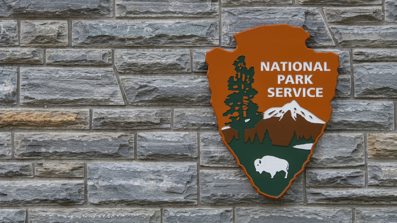 The U.S. National Park service emblem on a brick wall