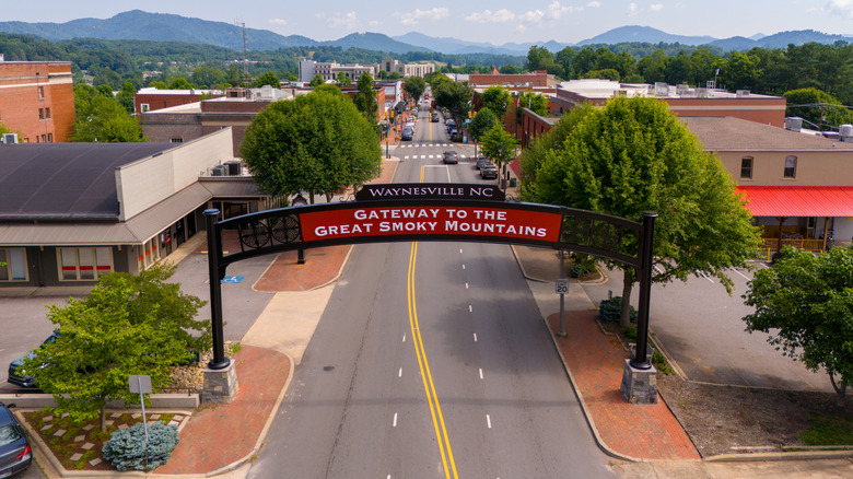 An aerial view of a main street in Waynesville, North Carolina, with a gateway arch
