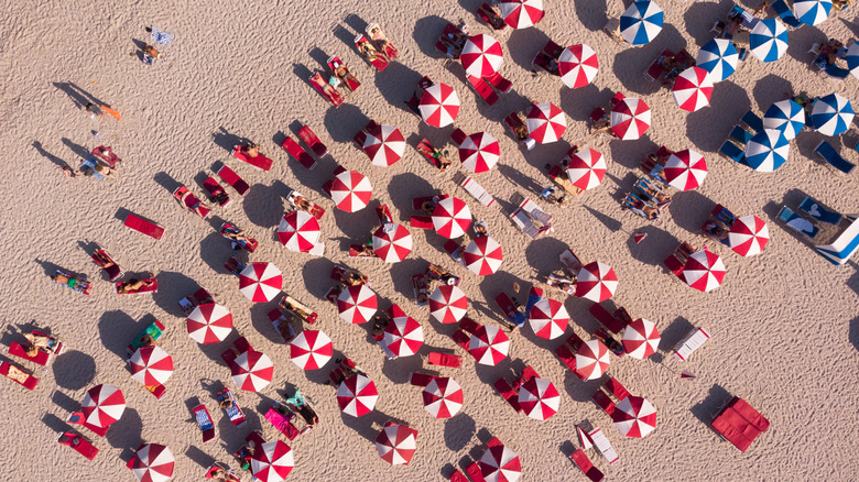 Umbrellas and sunbathers on South Beach, seen from above