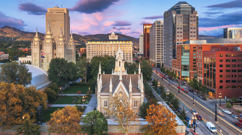 A church surrounded by tall buildings