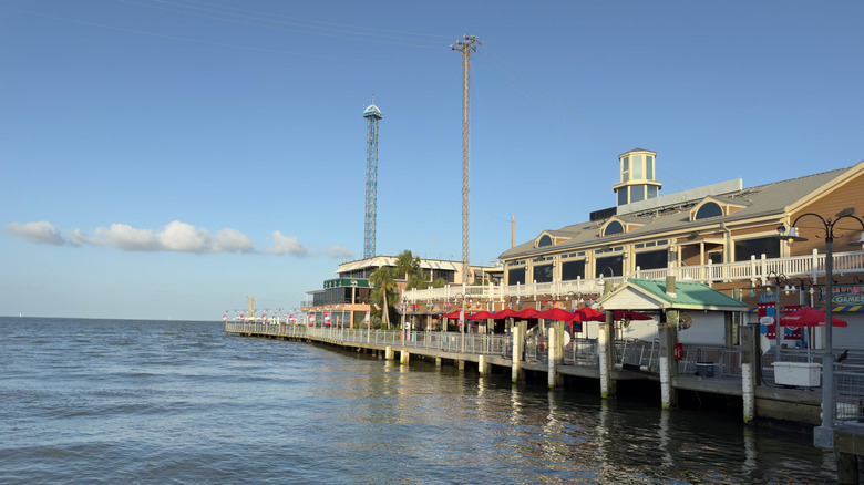 Kemah Boardwalk's pedestrian walkway and buildings along the water