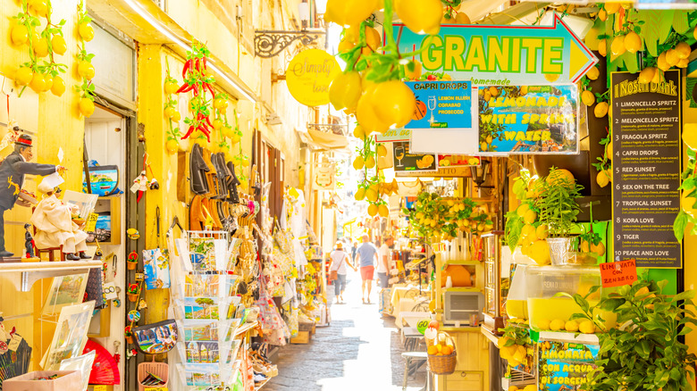 A bright Italian street lined with lemon-themed souvenir shops and restaurants