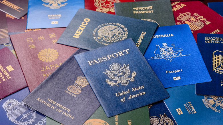 A pile of passports featuring a U.S. passport in the middle.