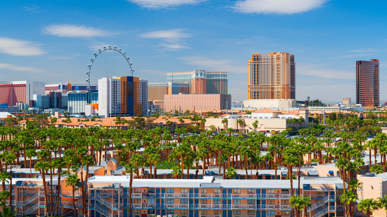 The skyline of Downtown Las Vegas with a Ferris wheel, during the day