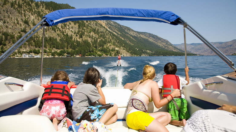 A family waterskiing on a sunny summer afternoon