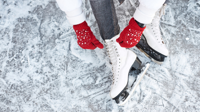 Close-up of a person tying their ice skates
