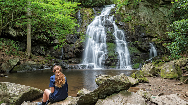 Young hiker looking at Spruce Flats Falls in the Smoky Mountains