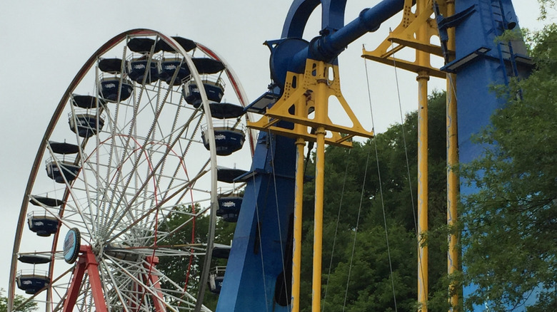 A steel roller coaster and Ferris wheel at Lake Compounce
