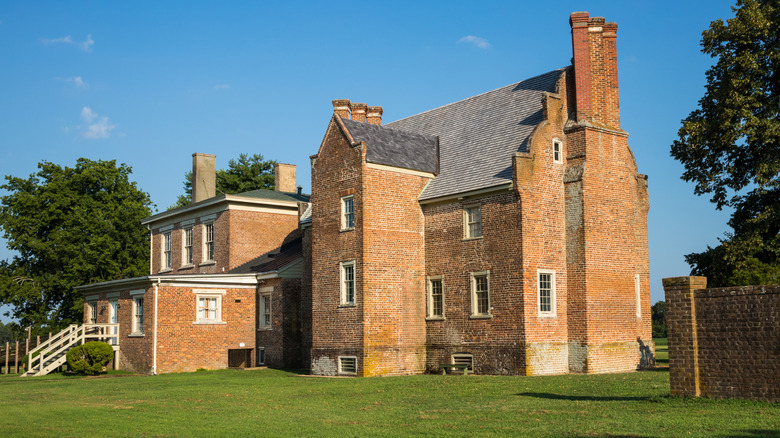 The exterior of the brick Bacon's Castle on a clear day