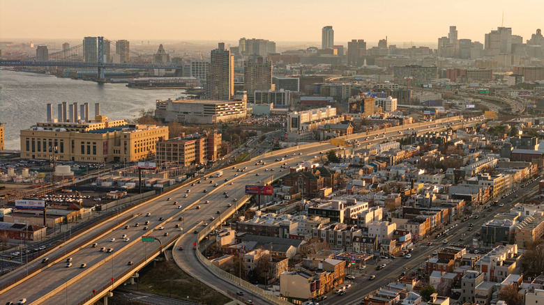 Traffic in Philadelphia from above, with buildings surrounding the highway