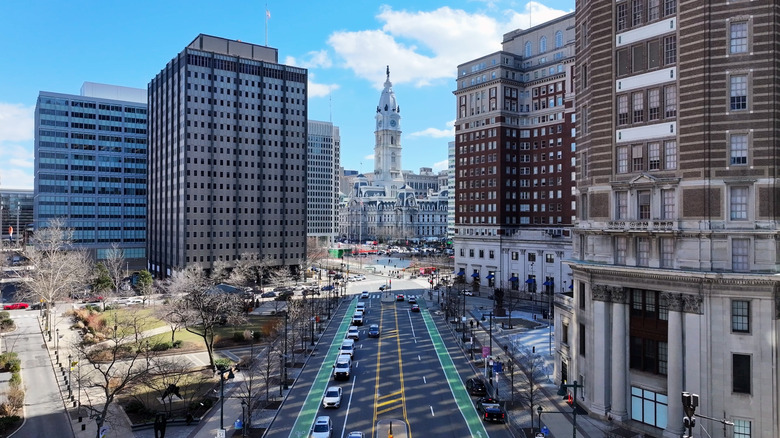 Philadelphia City Hall, pictured at the end of a street between buildings