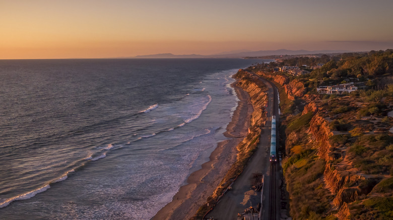 Pacific Surfliner Amtrak Train in Del Mar, California during sunset. Southern California