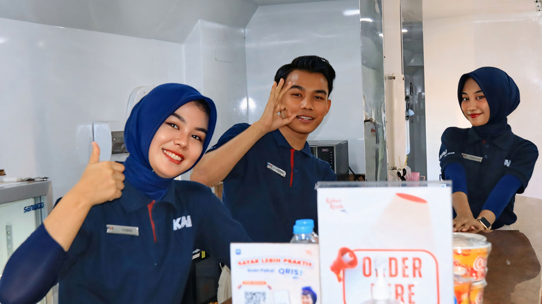 A young Indonesian train crew