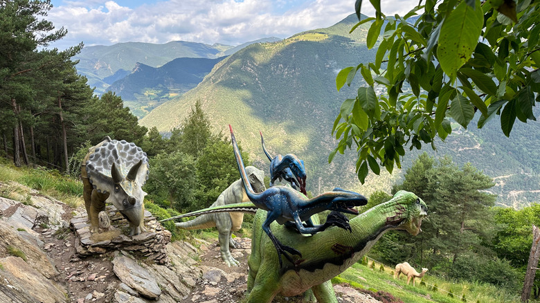 Large dinosaur sculptures on the edge of a mountain garden, Juberri, Andorra