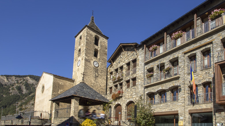 Stone buildings with clock tower in Ordino, Andorra