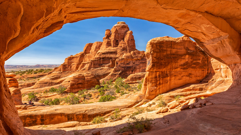 Looking through Tower Arch at the Klondike Bluffs area of Arches National Park