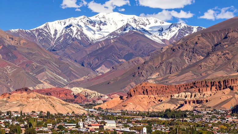 Aconcagua, South America's tallest mountain, rises in Argentina's Andes Mountains above a village below