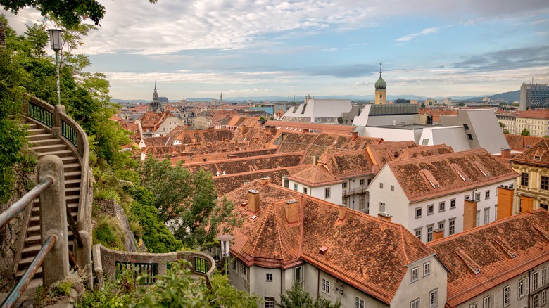 Aerial view of Old Town Gratz, Austria with a winding stone staircase on the left side