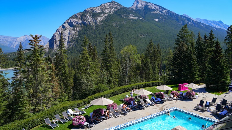 Outdoor pool overlooking mountains at Fairmont Banff Springs Hotel
