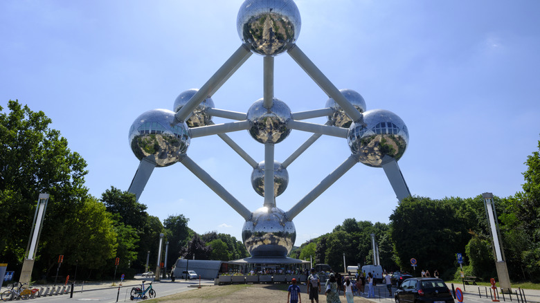 People walk toward the Atomium in Brussels