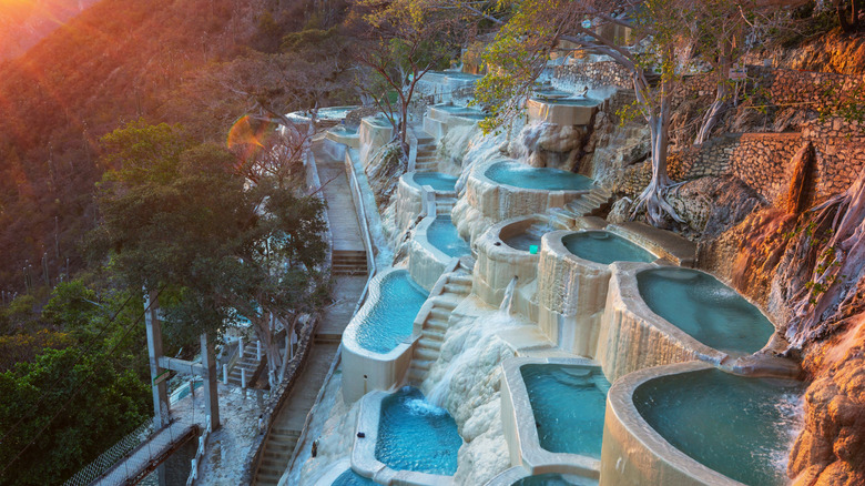 Grutas de Tolantongo thermal pools high on a mountainside overlooking a canyon in Mexico