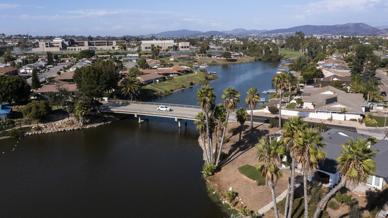 A bridge with a car in San Marcos, California, crossing Lake San Marcos