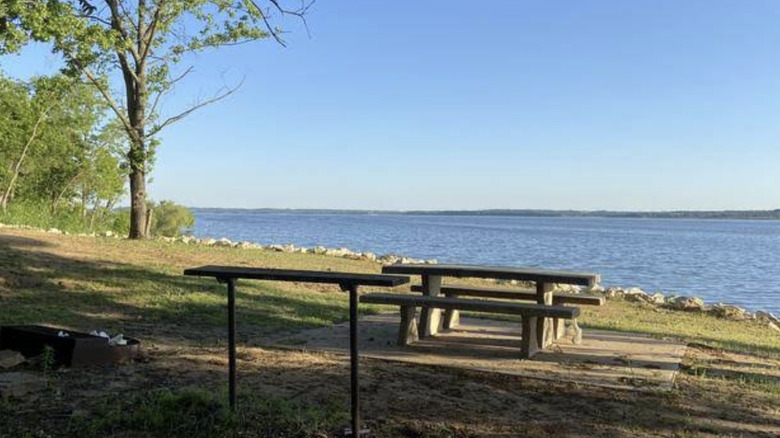A lakeside camping area at the Bear Creek Cove Campground on Kaw Lake