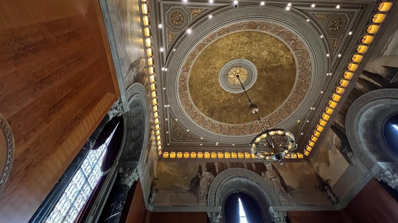 chandelier and gilded ceiling