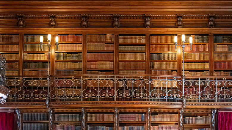 wood paneled storied bookshelves at Bilmore Estate Library