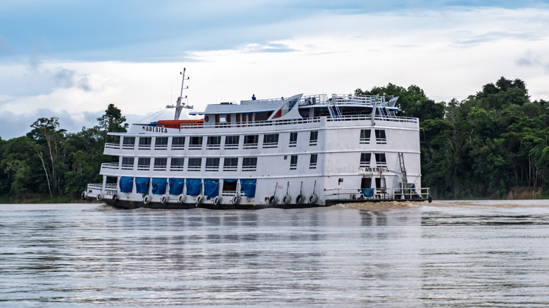Cruise ship floating down the Amazon River