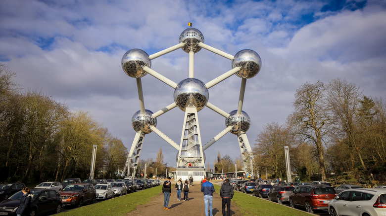 People walk toward the Atomium in Brussels