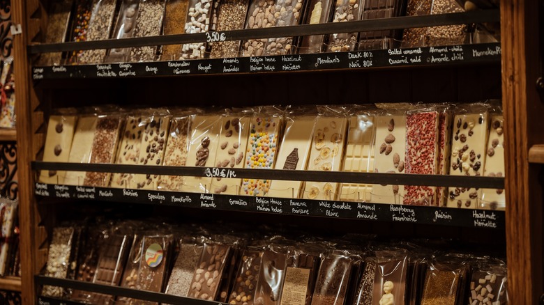 Shelves of different handmade chocolate bars in a shop in Brussels