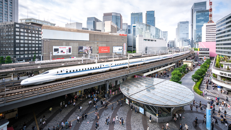 A bullet train pulling into a station in Tokyo