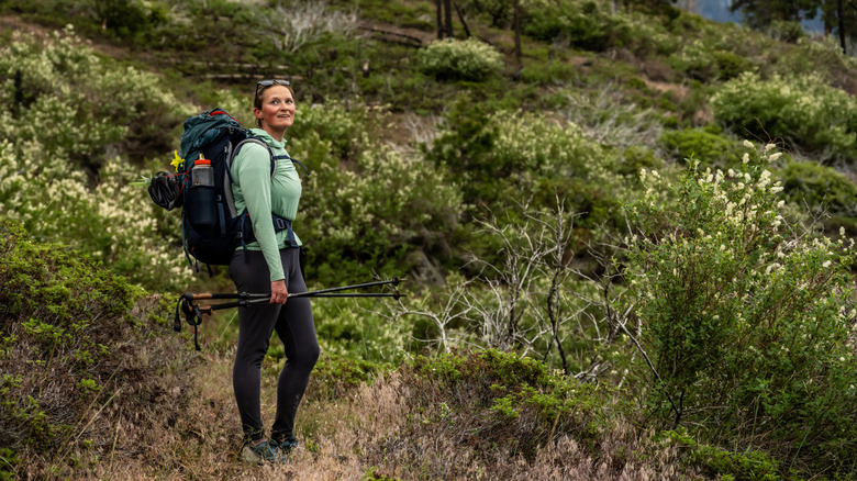 A female hiker takes in the scenery in California's Sierra Nevada
